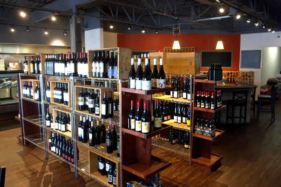 The retail room at The Butcher's Pantry, wine shelving running down the wall