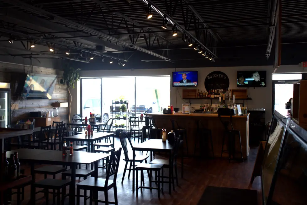 The dining room at The Butcher's Pantry with the shop logo painted on the wall