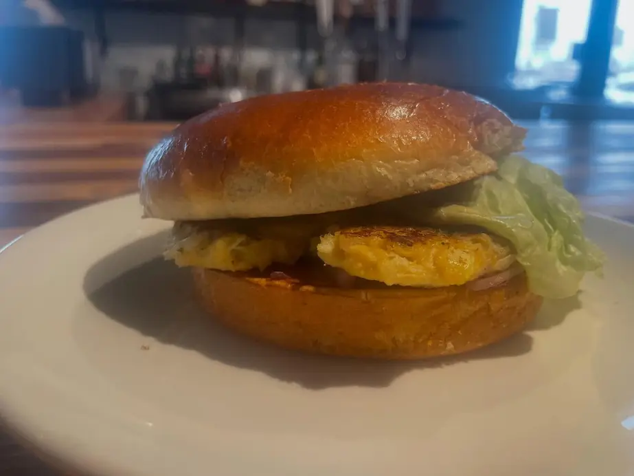A plated sandwich served at the bar